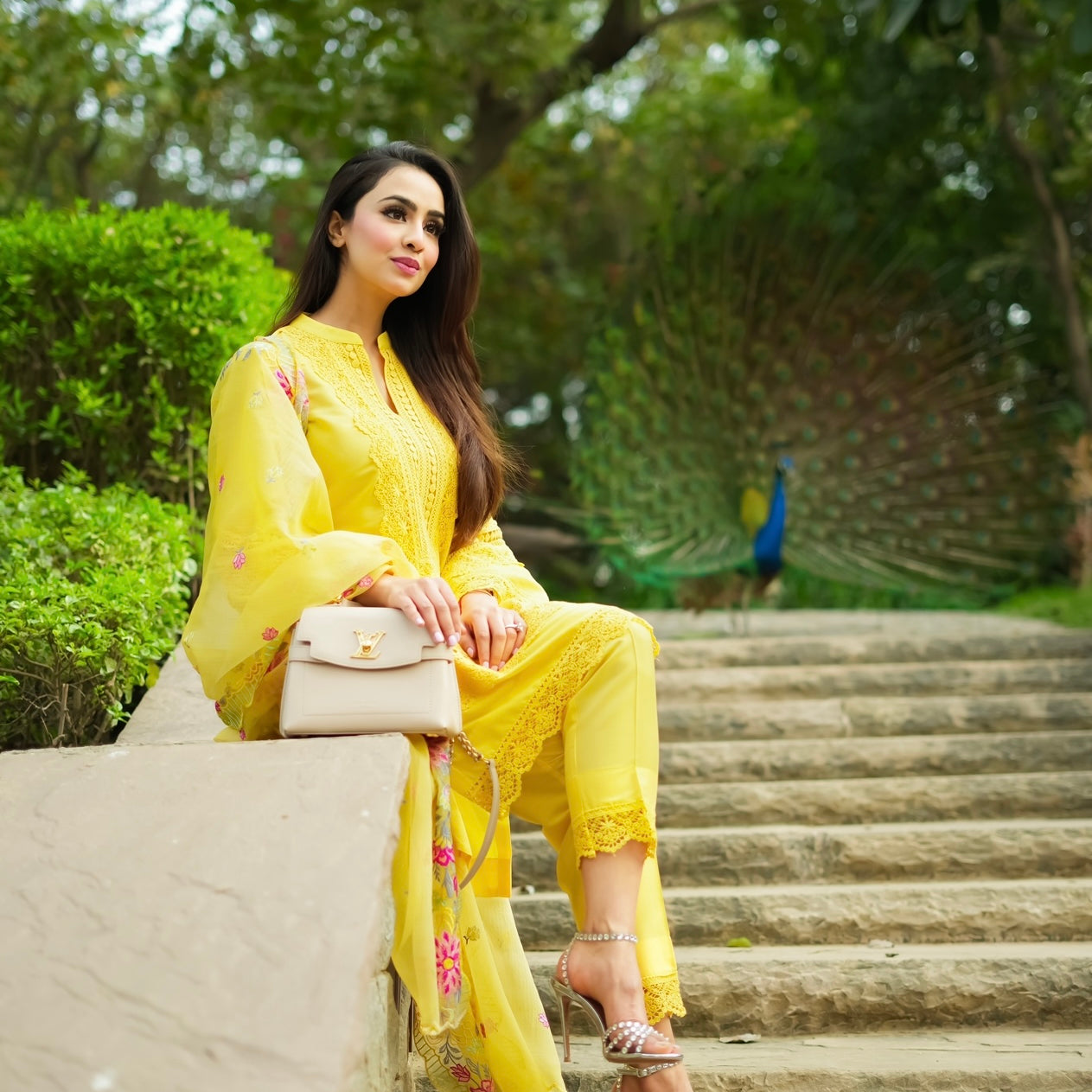 A dynamic yellow short kurta with matching pants is styled elegantly with fine laces for a cool and comfortable summer look. The embroidered duppatta in vibrant colours adds a dash of elegance and a contemporary look . A curation featuring delicate set on on artfully constructed silhouettes . 