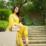 A dynamic yellow short kurta with matching pants is styled elegantly with fine laces for a cool and comfortable summer look. The embroidered duppatta in vibrant colours adds a dash of elegance and a contemporary look . A curation featuring delicate set on on artfully constructed silhouettes . 